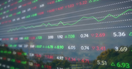 Image of financial data processing over cityscape. Global finance, business, connections, computing and data processing concept digitally generated image.の写真素材