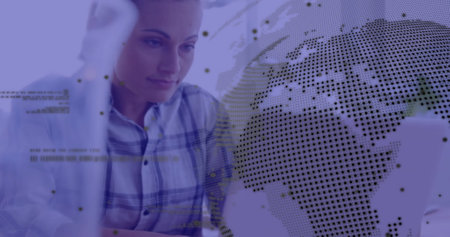 Image of globe and data processing over biracial businesswoman using laptop in office. Global finance, business, connections, computing and data processing concept digitally generated image.の写真素材