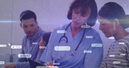 Processing medical data image, healthcare professionals reviewing patient information in office....