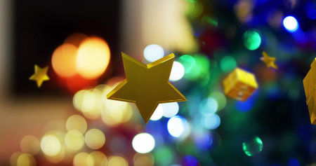 Gold stars and gifts floating over bokeh fire in fireplace and christmas lights on tree. Christmas, winter, new year, tradition and celebration digitally generated image.の写真素材