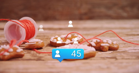 Image of media icons over cookies at christmas. Christmas, tradition and digital interface concept digitally generated image.の写真素材