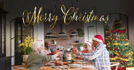 Image of merry christmas text over diverse senior friends at christmas dinner at home. Chirstmas, celebration and tradition concept digitally generated image.の写真素材