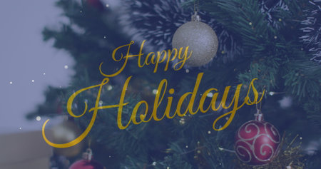 Image of christmas greetings text over christmas tree and decorations. Christmas, festivity, celebration and tradition concept digitally generated image.の写真素材