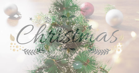 Image of christmas greetings text over christmas tree and decorations. Christmas, festivity, celebration and tradition concept digitally generated image.の写真素材