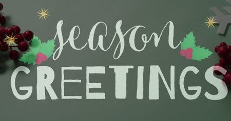 Image of christmas greetings text over christmas decorations. Christmas, festivity, celebration and tradition concept digitally generated image.の写真素材