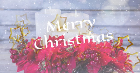 Candles burning behind bright Merry Christmas message. Red flowers and golden stars add festive cheer to a snowy backdropの写真素材