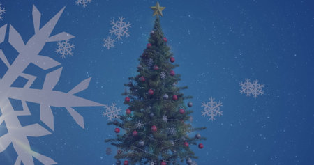 Image of snowflakes icons over decorated christmas tree against blue background with copy space. Christmas festivity and celebration conceptの写真素材