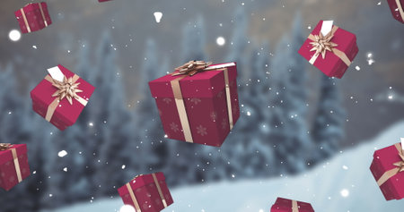 Image of falling snow and red christmas presents over winter landscape. Christmas, winter, festivity, tradition and celebration concept digitally generated image.の写真素材