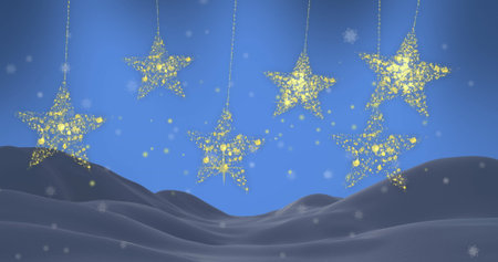 Image of gold christmas stars swinging with snow falling over winter landscape. Christmas, winter,...