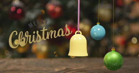 Image of christmas greetings text over christmas decorations. Christmas, festivity, celebration and tradition concept digitally generated image.の写真素材