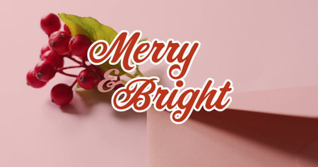 This image is a digital image of a text banner that reads merry and bright the banner is against a black background, and the image features christmas decorations including holly, red berries, and an envelopeの写真素材