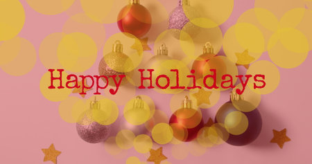 Image of happy holidays text over christmas baubles. Christmas, celebration and digital interface concept digitally generated image.の写真素材