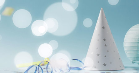 Image of stramer and party hat. New year's eve, christmas, festivity, celebration and tradition concept digitally generated image.の写真素材