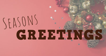 Image of seasons greetings text banner against christmas decorations on red surface. Christmas festivity and celebration conceptの写真素材