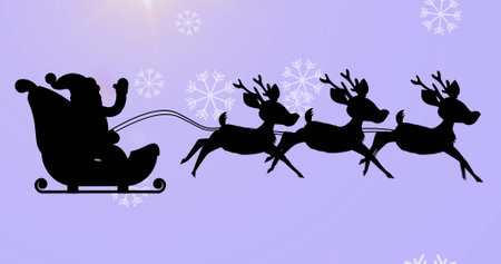 Santa claus in sleigh being pulled by reindeers over snowflakes falling against purple background. christmas festivity and celebration conceptの写真素材