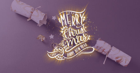 Image of christmas greetings text over christmas cracker decorations. Christmas, festivity, celebration and tradition concept digitally generated image.の写真素材