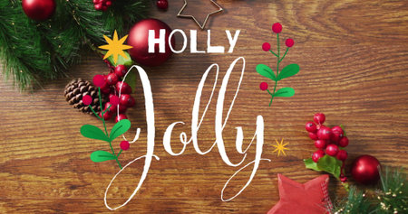 Image of holly jolly text over christmas decorations on wooden background. Christmas, festivity, celebration and tradition concept digitally generated image.の写真素材