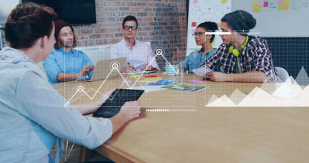 Image of financial data processing over diverse business people in office. Global finance, business, connections, computing and data processing concept digitally generated image.の写真素材