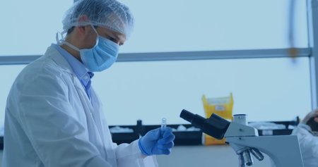 Image of data processing and world map over caucasian male scientist. Global science, finances,...