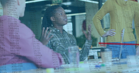 Image of processing data over diverse male and female colleagues discussing at casual office. Data, digital interface, business, teamwork, connection and communication, digitally generated image.の写真素材