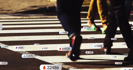 Image of social media icons with growing numbers over people and cars on city street. Global social...