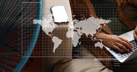 Image of digital data processing over caucasian woman using laptop. Global connections, computing and data processing concept digitally generated image.の写真素材