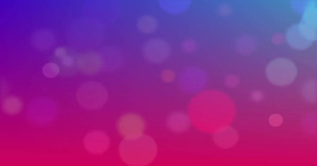 Image of glowing light spots over pink background. Light, colour and movement concept digitally...
