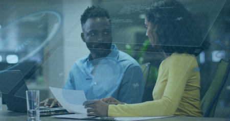 Image of data processing and diagrams over diverse business people discussing work. Global business and digital interface concept digitally generated image.の写真素材