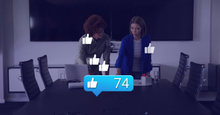 Image of network of thumbs up icons over diverse business people in office. Global finance,...