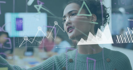Image of financial data processing over biracial businesswoman in office. Global finance, business,...
