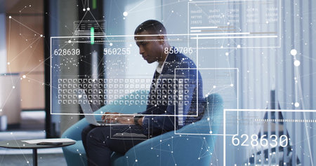 Image of digital data processing over african american businessman using laptop in office. Global...