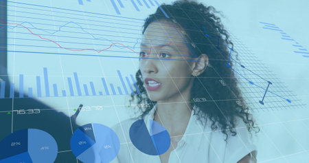 Image of financial data processing over diverse colleagues discussing work in office. Global...