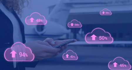 Image of cloud and percent growing over caucasian businesswoman using smartphone. Global finance,...