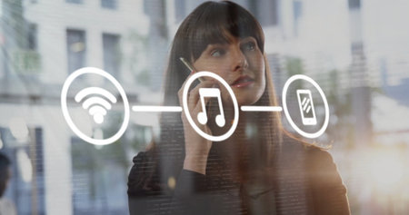 Image of network of connections with digital icons over caucasian businesswoman using smartphone. Global connections, computing and data processing concept digitally generated image.の写真素材