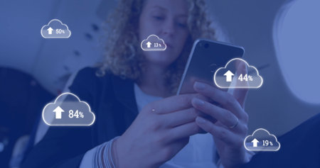 Image of clouds with percents and arrow over caucasian businesswoman using smartphone. Social media,...