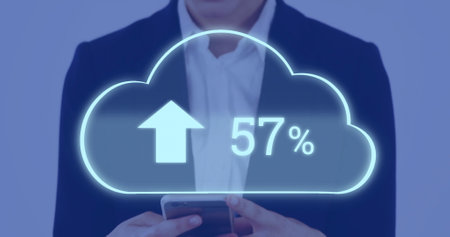 Image of ncloud with percent growing over caucasian businesswoman using smartphone. Global...