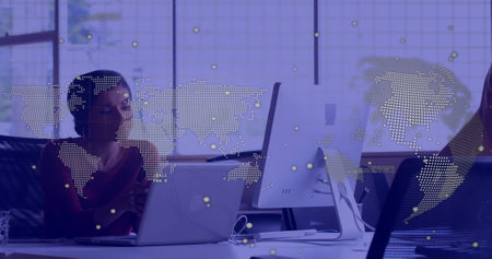 Image of data processing over biracial businesswoman using laptop. Global finance, business,...