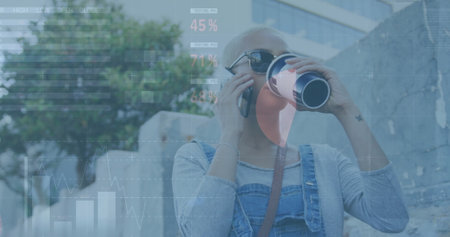 Image of financial data processing over biracial woman using smartphone. Global business, finances,...