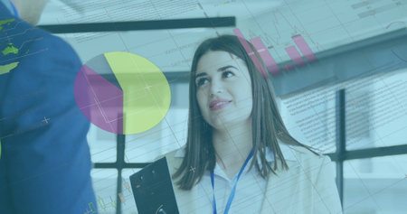 Image of financial data processing over caucasian businesswoman in office. Global finance, business,...