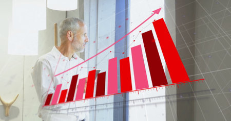 Image of financial data processing over caucasian businessman using smartphone. Global finance, business, connections, computing and data processing concept digitally generated image.の写真素材