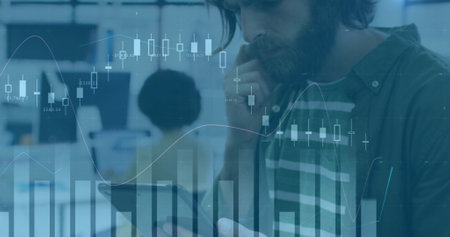 Image of financial data processing over caucasian businessman using tablet in office. Global...