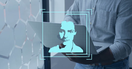 Image of data processing and people icons over biracial businessman using laptop in office. Business, technology and digital interface concept digitally generated image.の写真素材