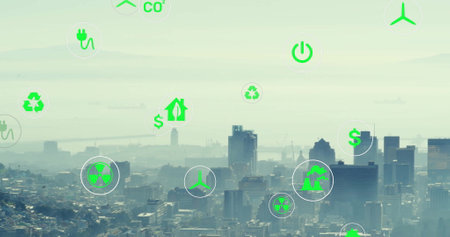 Image of network of eco icons over cityscape. Global environment, connections, computing and data processing concept digitally generated image.の写真素材