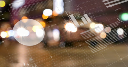 Financial charts and graphs image over blurred city lights background. Finance, data, economy,...
