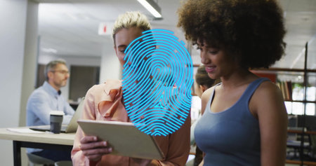 Image of blue fingerprint over diverse colleagues talking in creative office. Business, teamwork and...
