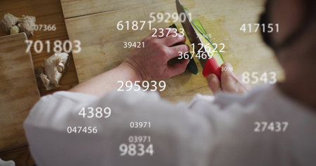 Chopping vegetables, chef&#39;s hands with numbers over indicating data processing. Cooking, culinary, kitchen, analysis, technology, innovationの写真素材