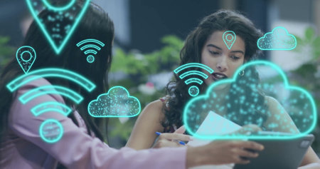 Image of digital wifi and cloud icons over diverse business people in office. Global finance,...
