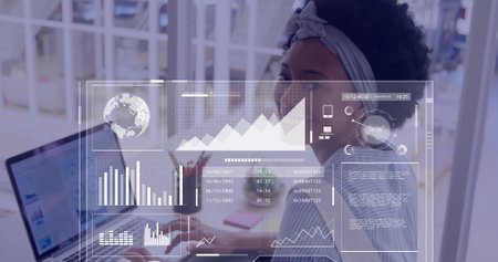 Image of data processing over african american businesswoman using laptop in office. Global business...
