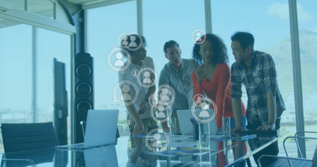 Image of people icons and data processing over diverse business people in office. Global finance,...