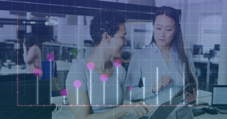 Image of diagrams over diverse female colleagues talking in office. Business, technology and digital...